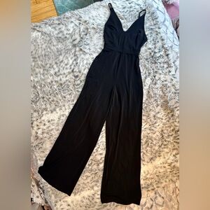 Black Wide-Leg Jumpsuit Stretchy V Neck Lace Up Open Back Sexy Chic Comfort XS